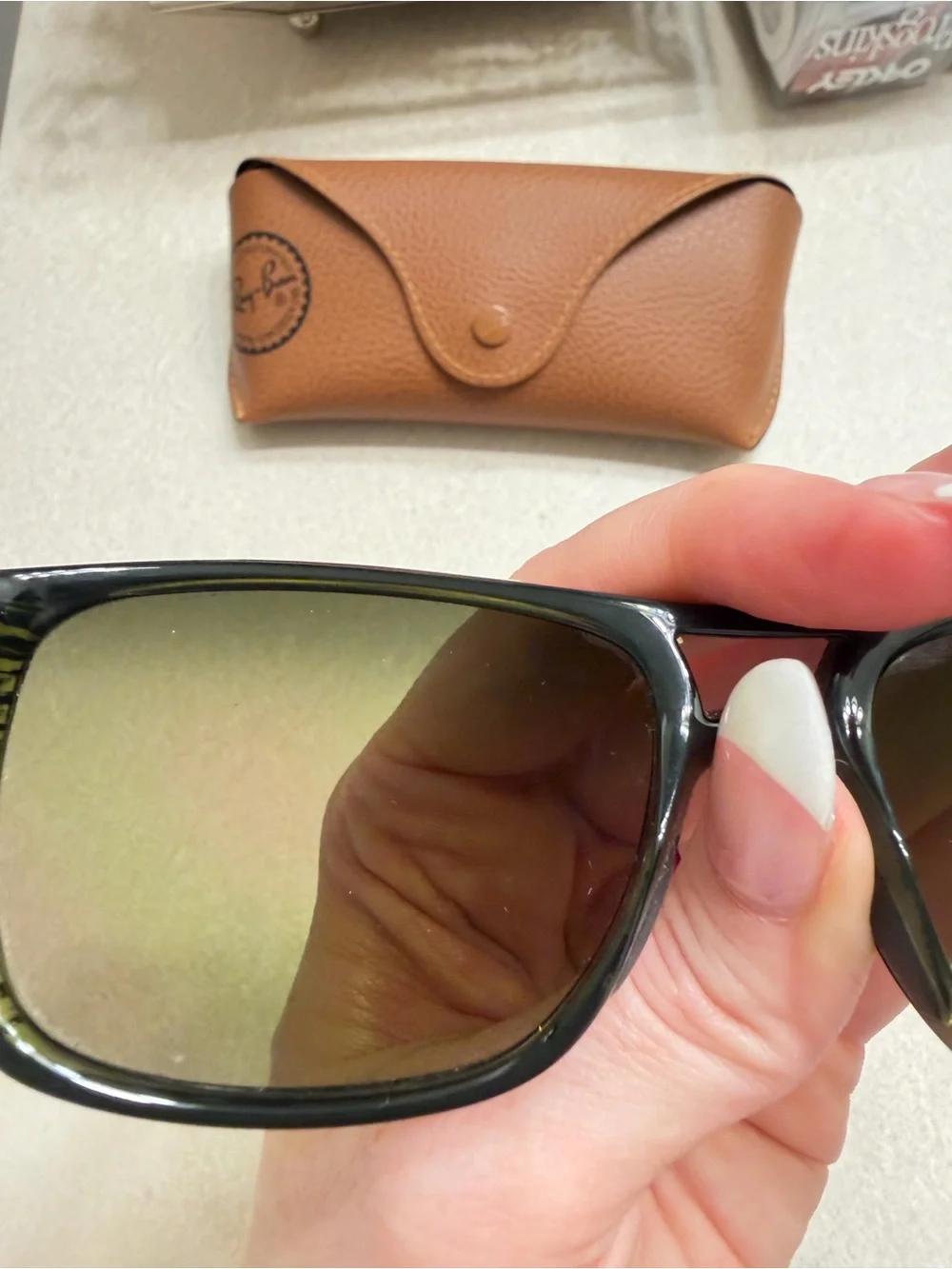 Maui Jim Black Frame Sunglasses with Green-Tinted Lenses